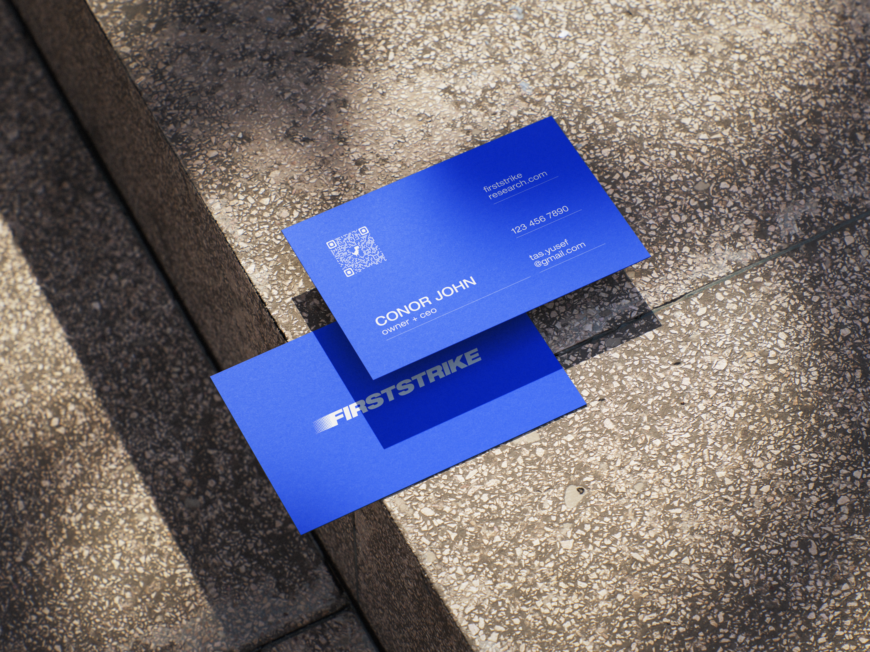 FirstStrike Research business card mockup on concrete