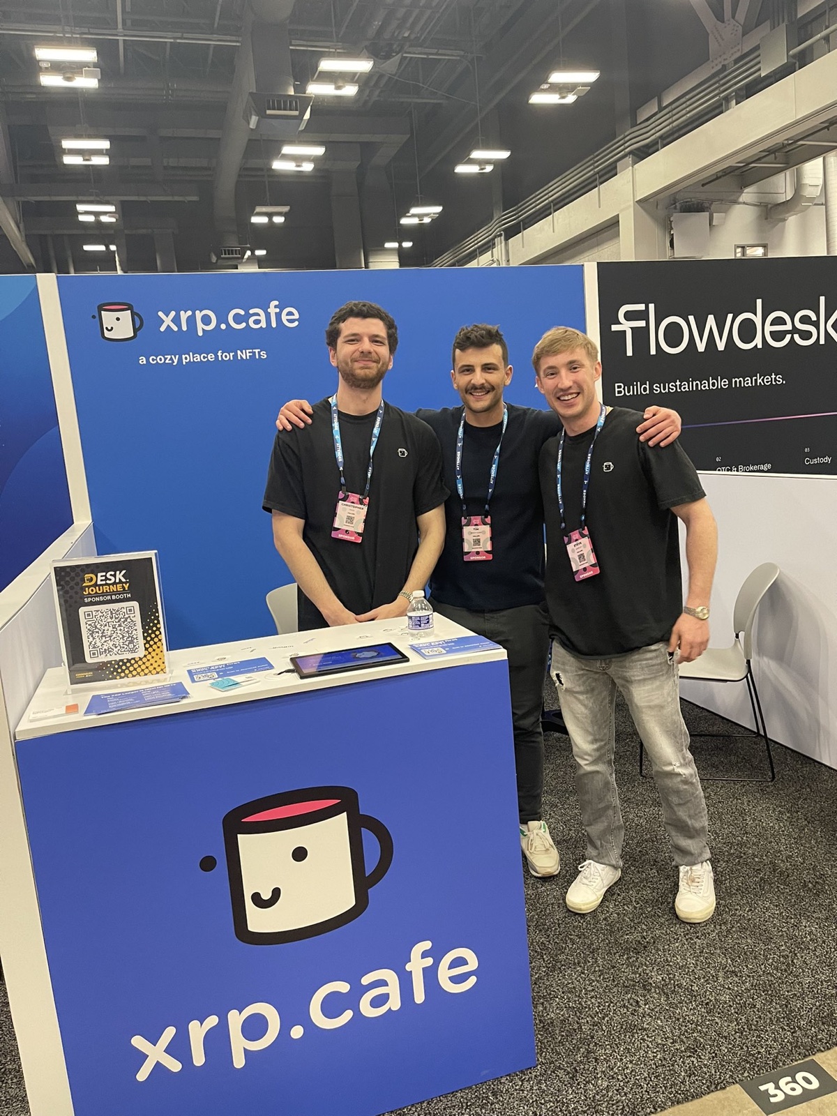 xrp.cafe team at the Consensus booth